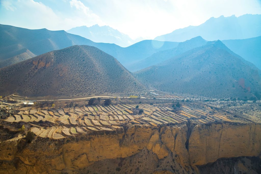 Layers of terraced plots climb a mountainside, showing historic ingenuity